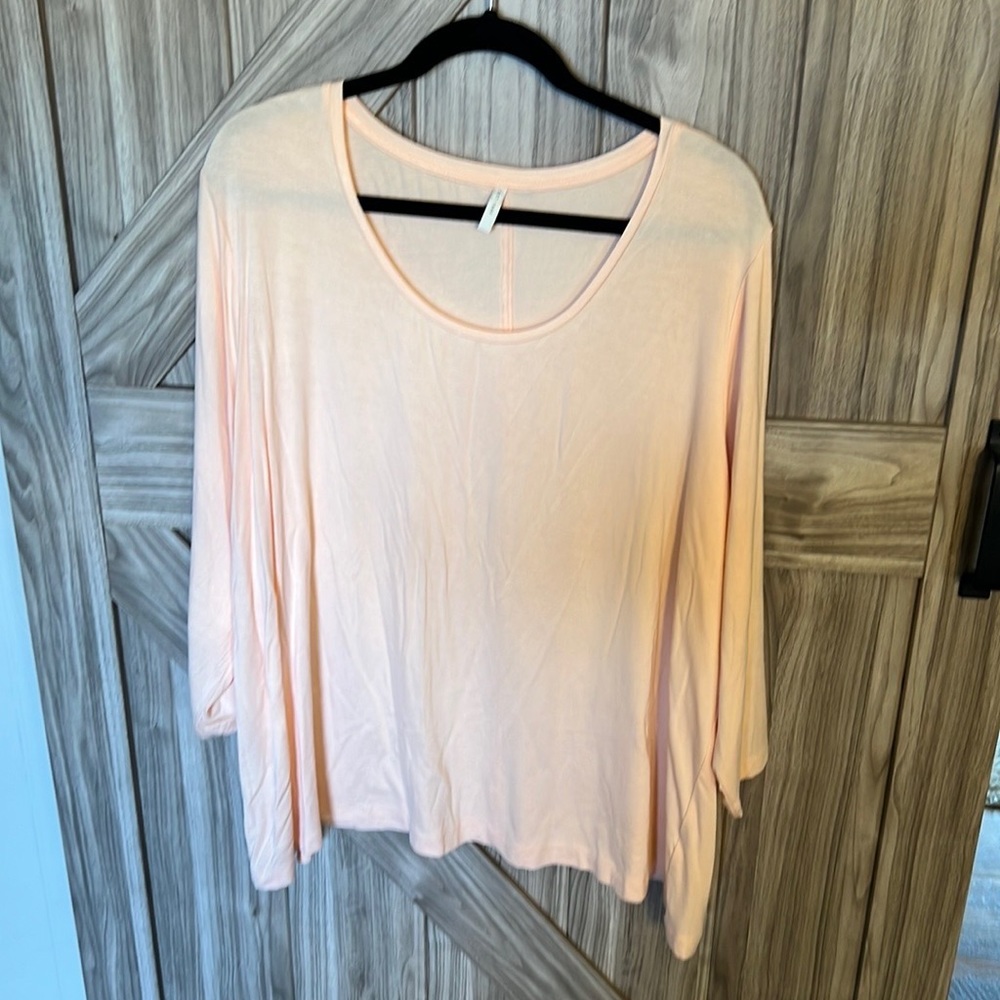 New without tags perfect Springtime peach colored shirt with 3/4 length sleeves